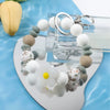Retro Daisy Silicone Bead Bracelet Keychain with Floral Accent
